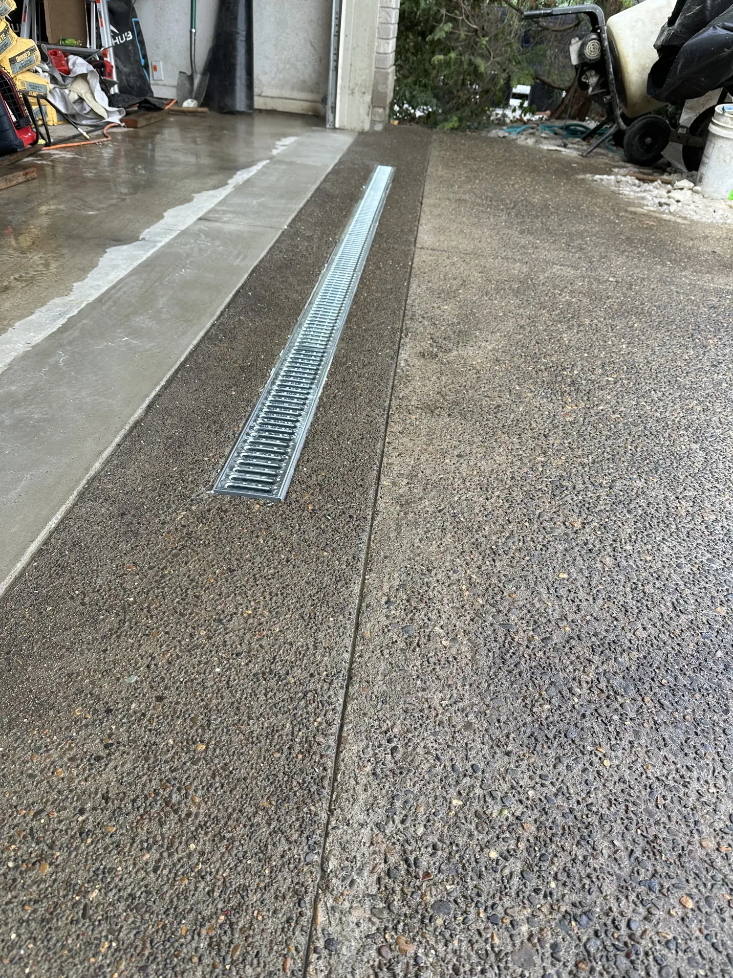 Concrete driveway and installed drainage channel