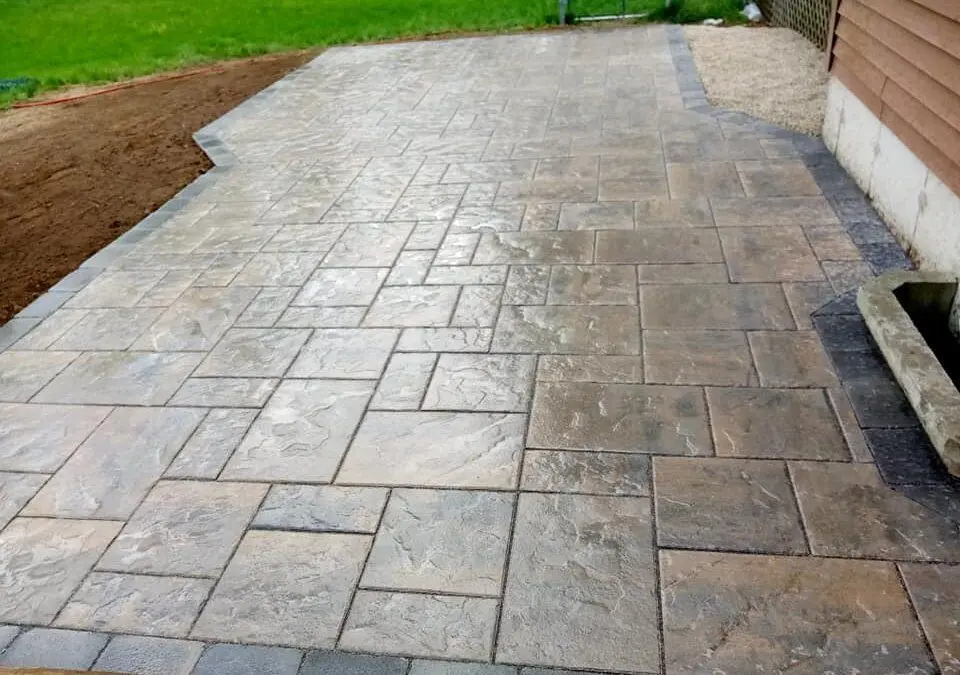 Patterned concrete patio with a contrasting border from Maximus’s gallery